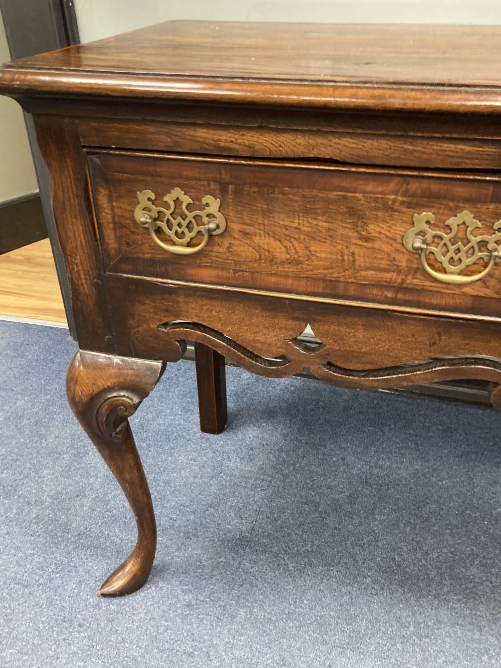 A mid 18th century style oak and mahogany crossbanded dresser, fitted three small drawers, raised on cabriole legs